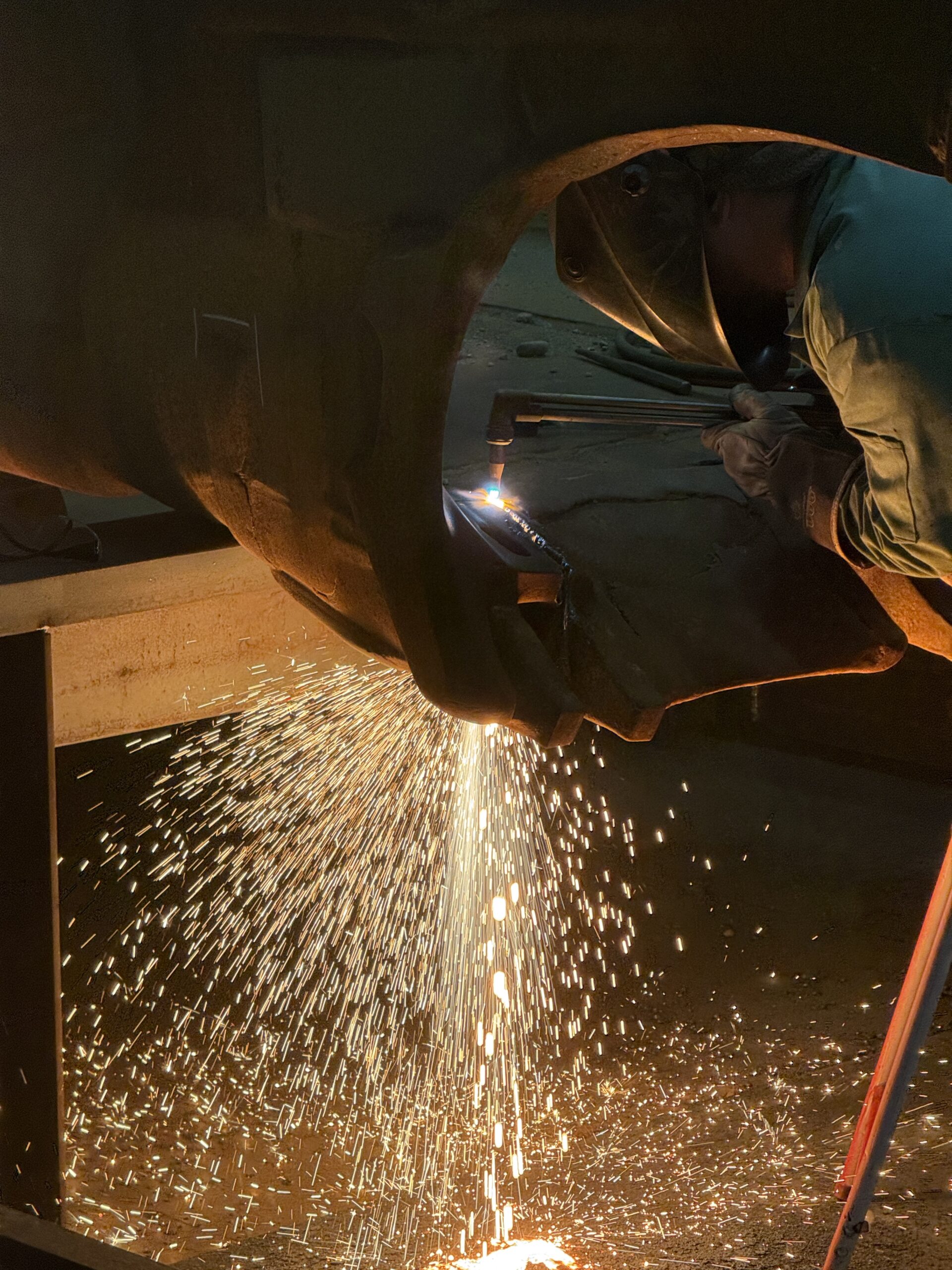 ESCO Dragline Bucket Rebuild Welder performing structural repair welding on ESCO dragline bucket during heavy equipment rebuild